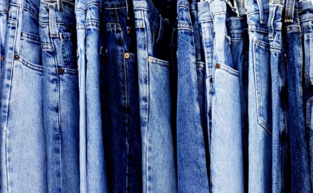 Who revolutionized clothing by using denim for pants